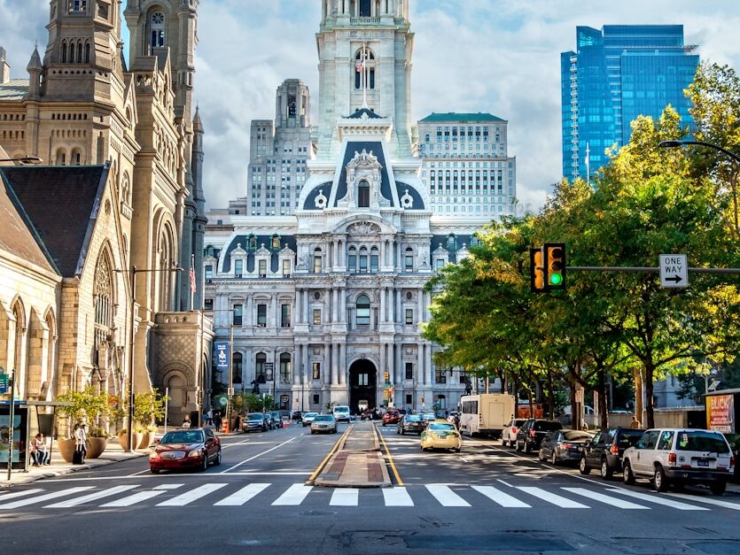 white wall paint building near on towers