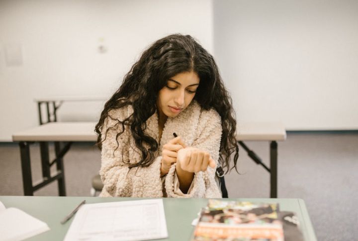 Writing Down A Friend’s Phone Number On Your Hand