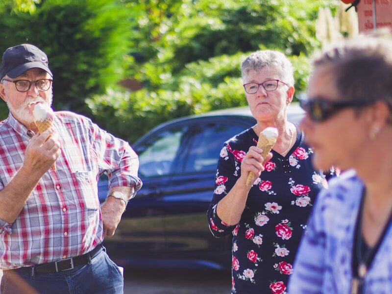 three persons near car