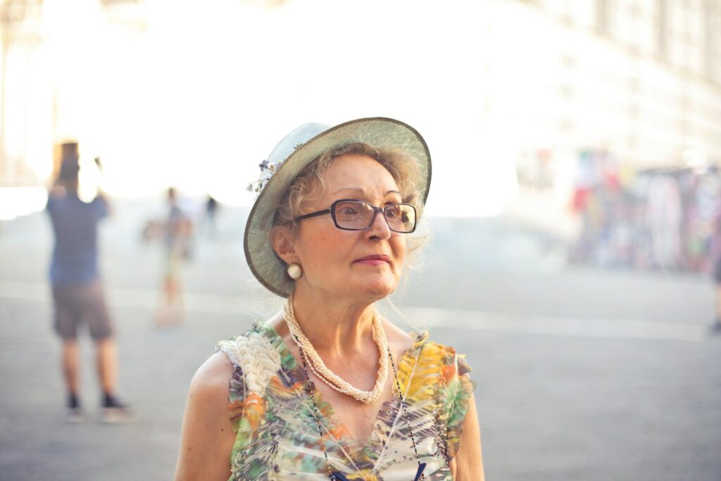 Elegant senior woman in Florence, Italy, enjoying a sunny day.