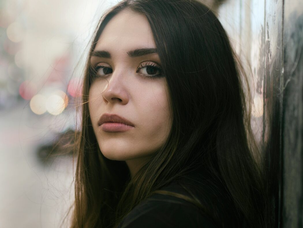 girl wearing black top selective focus photography