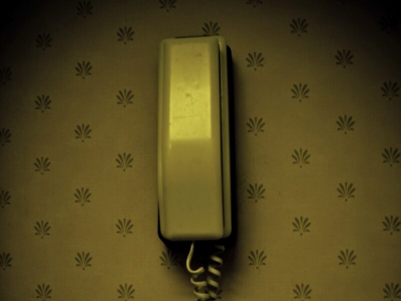 an old fashioned telephone on a wall in a room