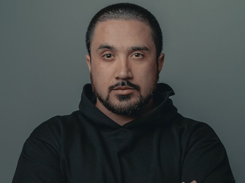 man in black hoodie standing