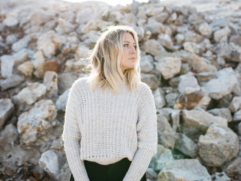 woman in gray sweater and black skirt