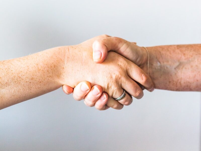 person holding hands of another person
