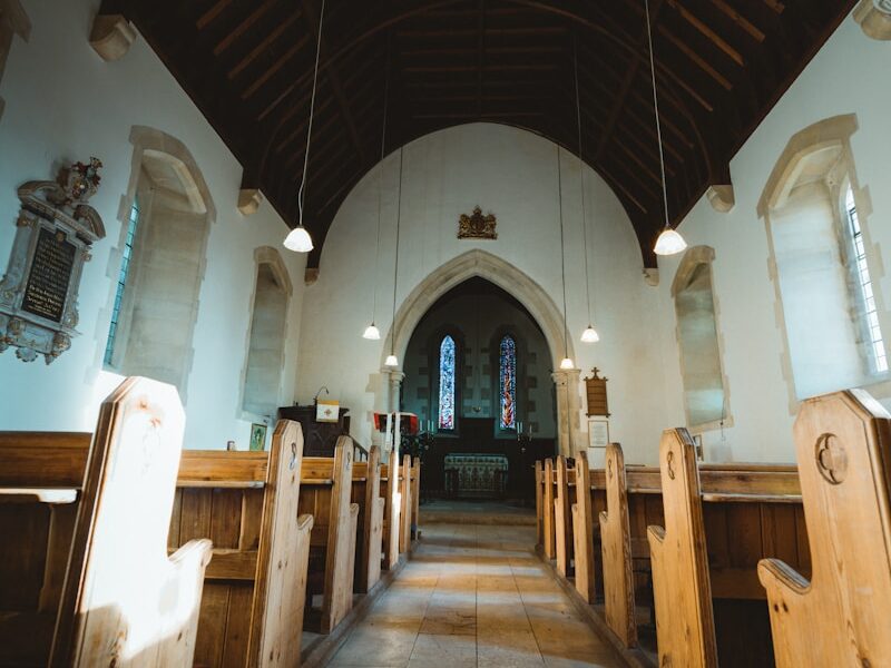 brown wooden chairs inside church