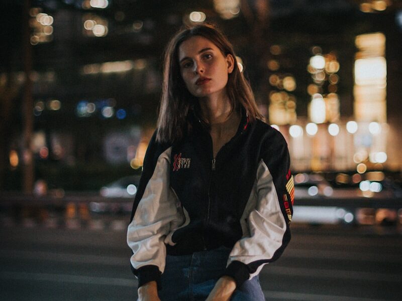 woman sitting on a fire hydrant