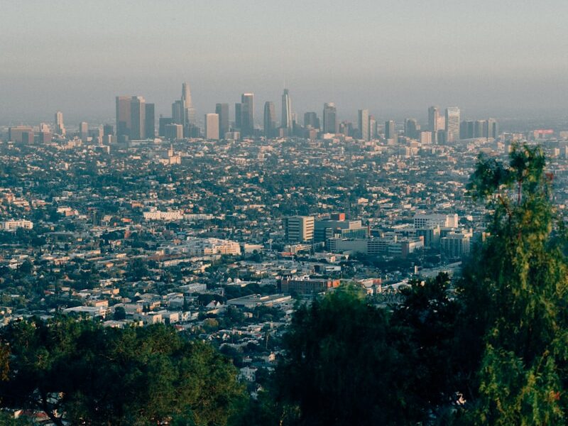 a view of a city from the top of a hill