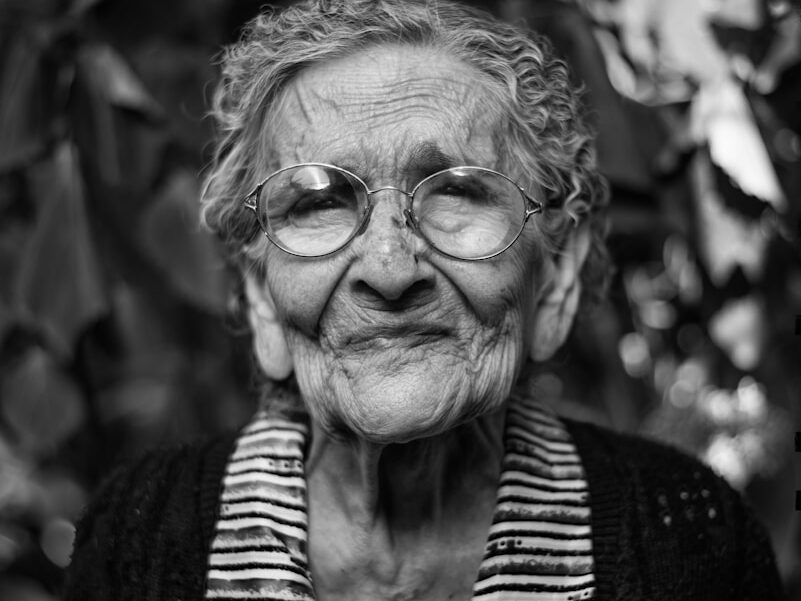 grayscale photography of woman standing