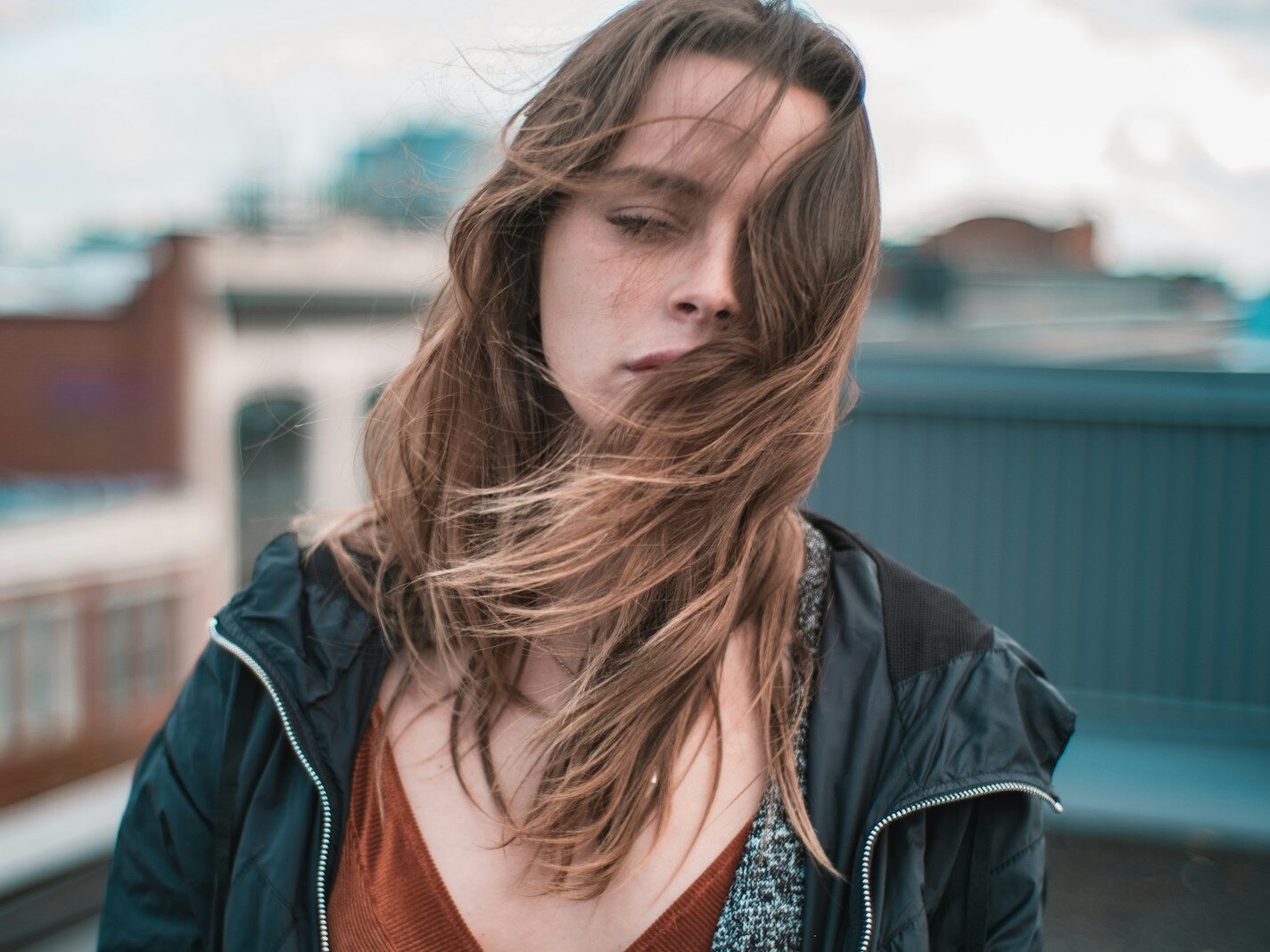 woman wearing blue zip-up jacket