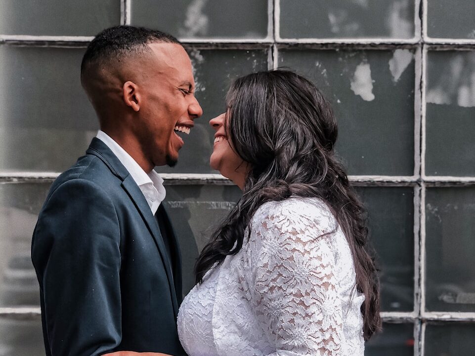 a man and a woman standing next to each other