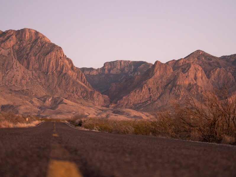 a view of a mountain range from a road