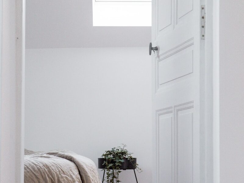 white bed linen on bed