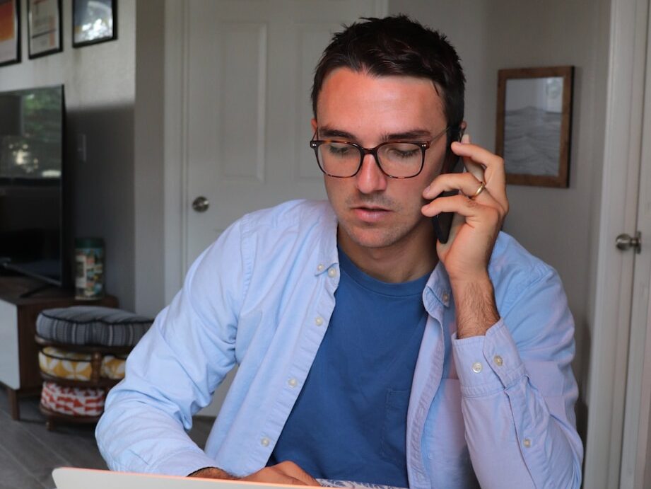 woman in white long sleeve shirt wearing eyeglasses