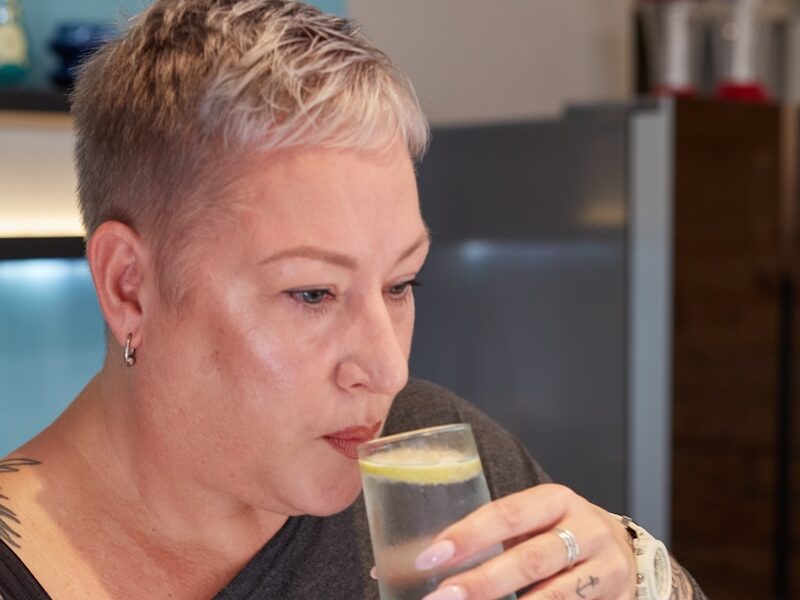 a person enjoying a glass of water