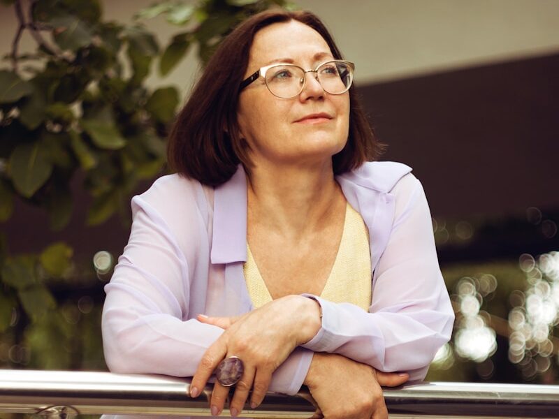 woman in white blazer and yellow dress shirt