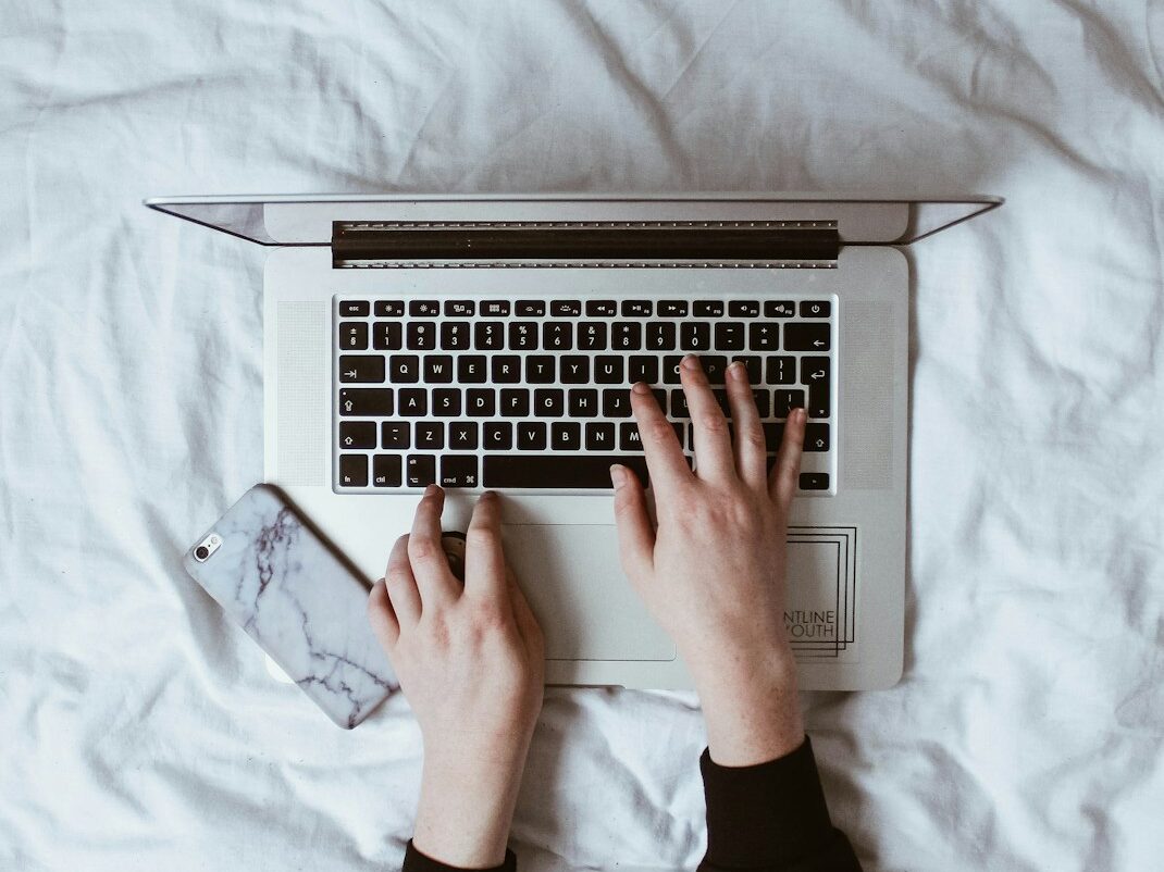 person using laptop computer