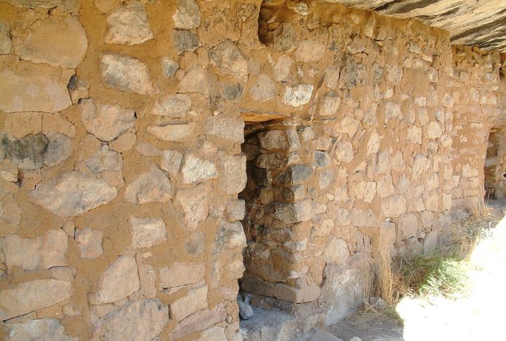Hidden Granaries In Canyon Walls

